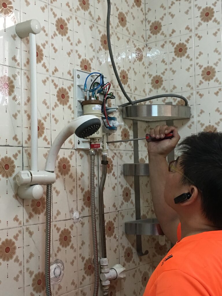 electrician-fixing-instant-water-heater