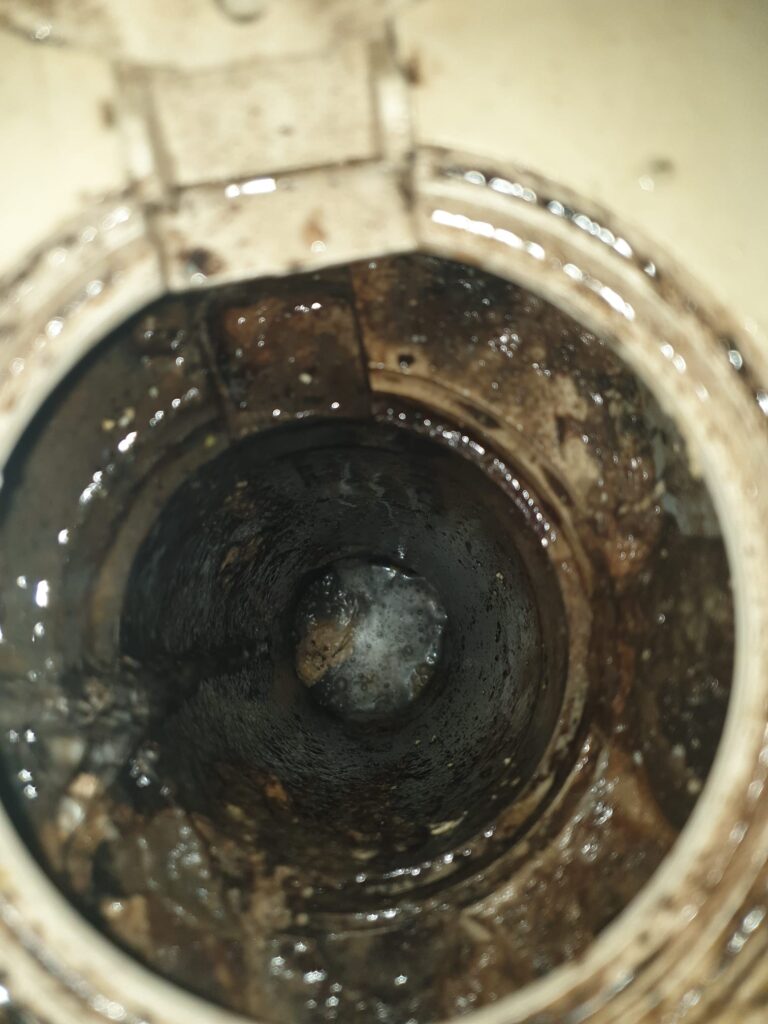 debris stuck inside pipe of drain causing choke