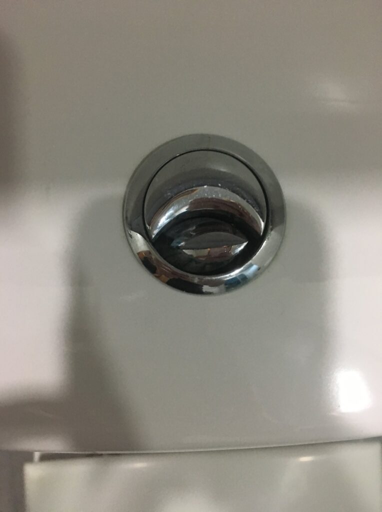 toilet-flush-button-one-side-stuck